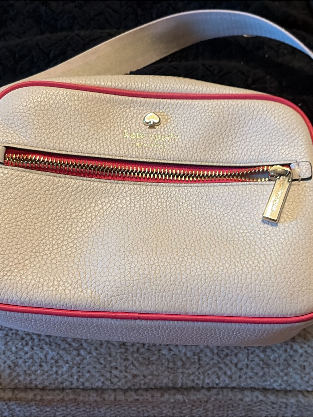kate spade cream crossbody with pink trim and gold hardware